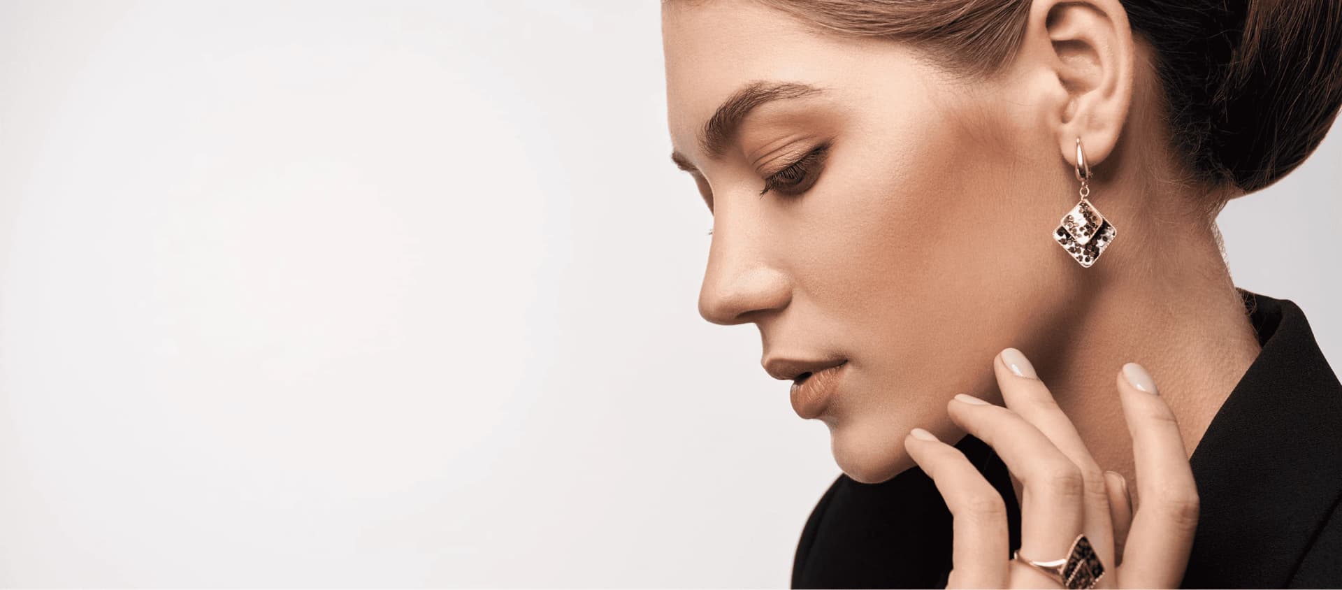 Woman wearing VILIA gold earrings